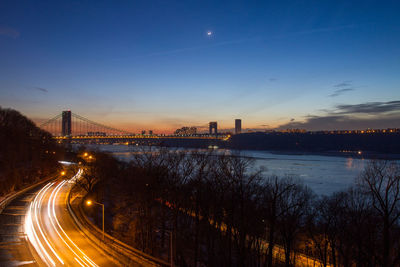 Illuminated bridge at night