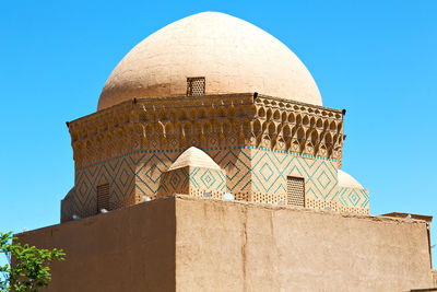 Low angle view of building against blue sky