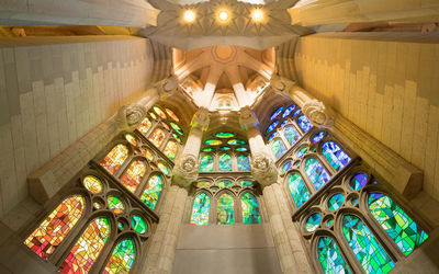 Low angle view of illuminated chandelier in building