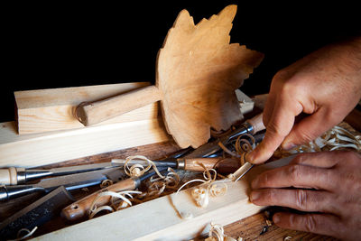 Close-up of man working on wood