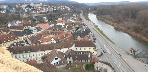 High angle view of river amidst buildings in city