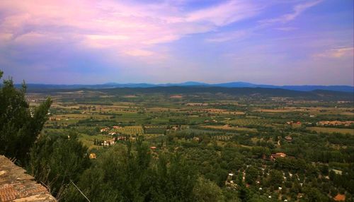 Scenic view of mountains against cloudy sky