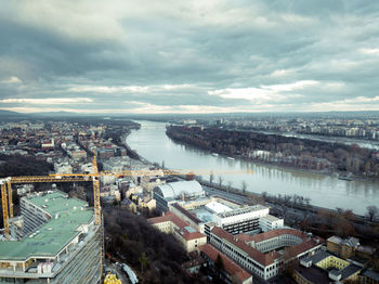 High angle view of river amidst buildings in city