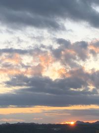 Low angle view of dramatic sky during sunset