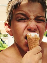 Close-up portrait of mid adult woman eating ice cream