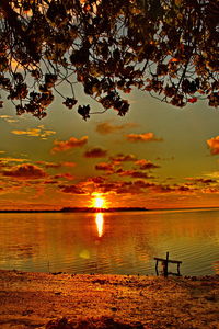 Scenic view of sea against orange sky
