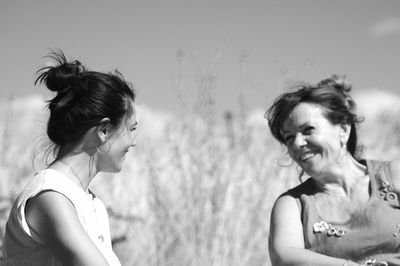 Portrait of happy woman against sky