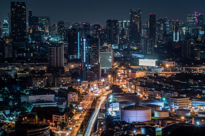 High angle view of illuminated city buildings at night