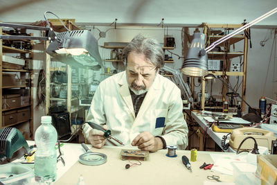 Electronic engineer in the laboratory with a soldering iron