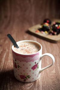 Close-up of coffee cup on table