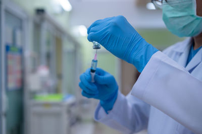 Close-up of person holding umbrella