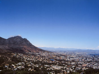 High angle view of townscape against blue sky