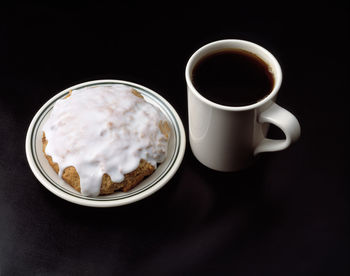 Close-up of cup of coffee served on table