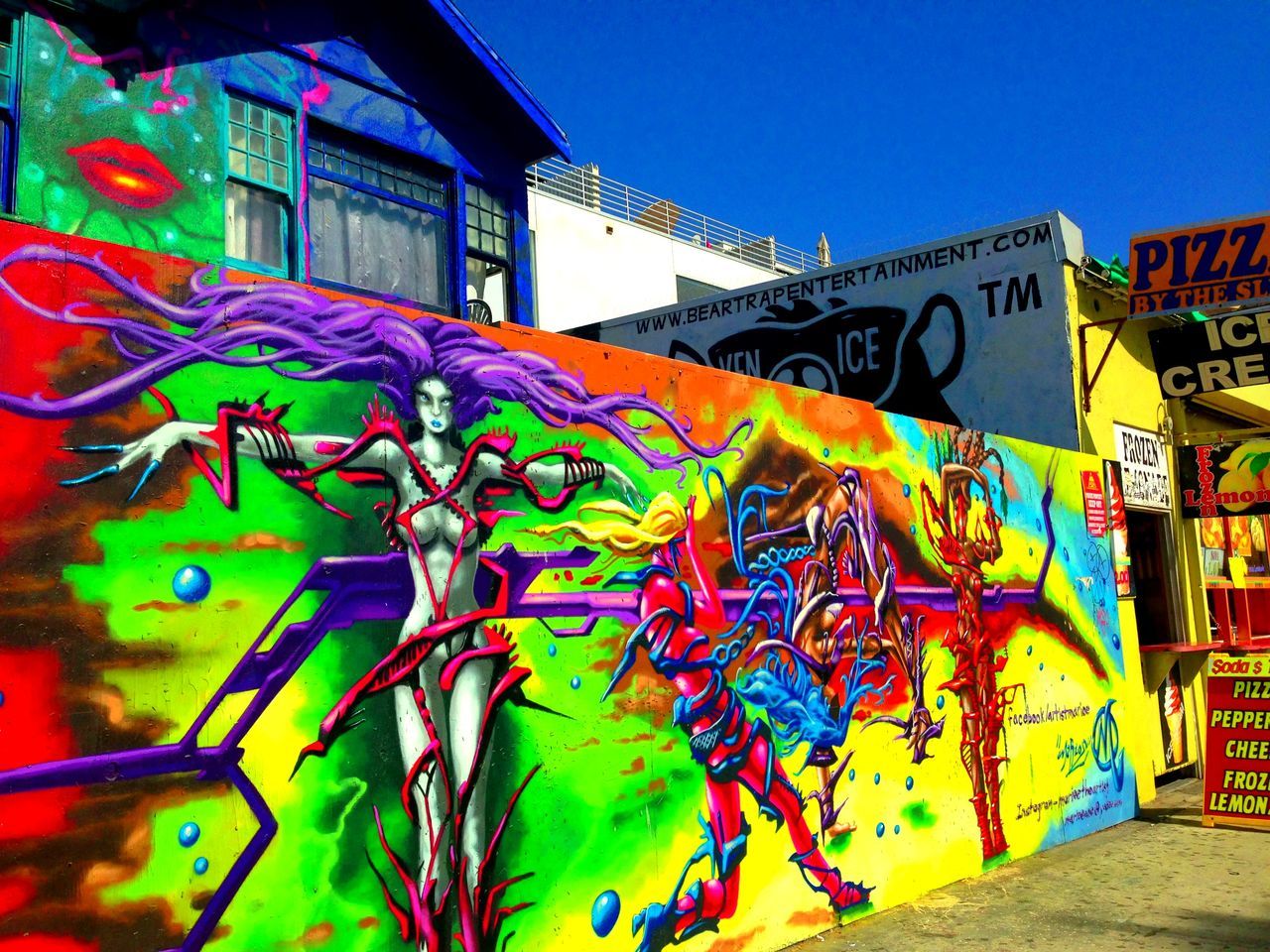 graffiti, art, creativity, art and craft, multi colored, architecture, built structure, text, wall - building feature, building exterior, street art, human representation, western script, communication, mural, colorful, blue, vandalism, low angle view