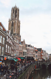 People by dom tower of utrecht in city