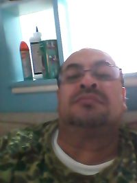 Close-up of man using mobile phone