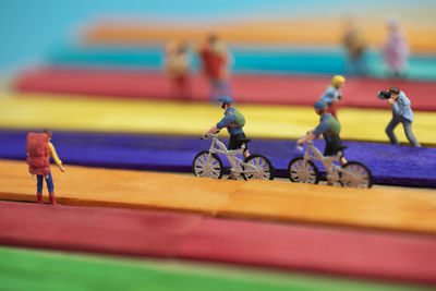 Close-up of figurine on deck chairs