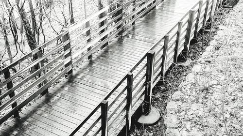 High angle view of footpath by railing