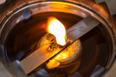 Close-up of burning candle