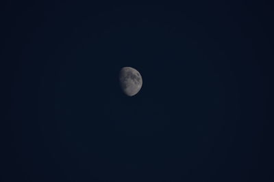 Low angle view of moon against clear sky at night