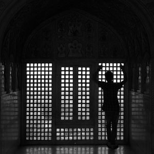 Silhouette woman standing in corridor