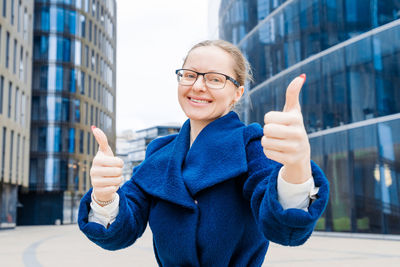 Portrait of young woman using mobile phone