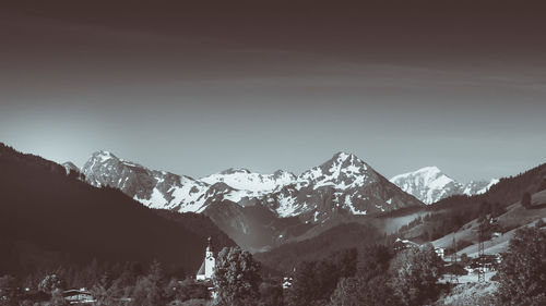 Scenic view of snowcapped mountains against sky