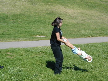 Full length of man standing on grassy field