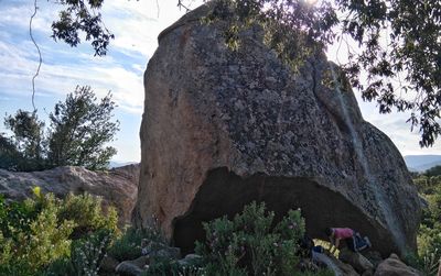 Low angle view of rock formation against sky