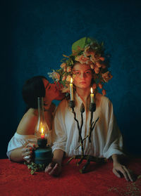 Portrait of woman sitting on stage