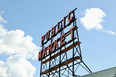 Low angle view of crane against sky