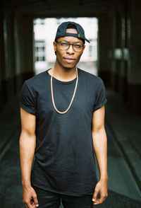 Portrait of handsome afro-american man standing outdoors