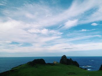 Scenic view of sea against cloudy sky