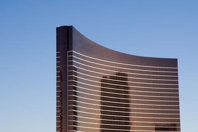 Low angle view of building against clear blue sky