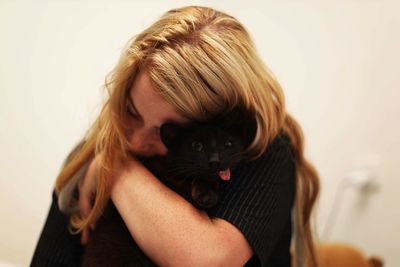Portrait of woman with cat