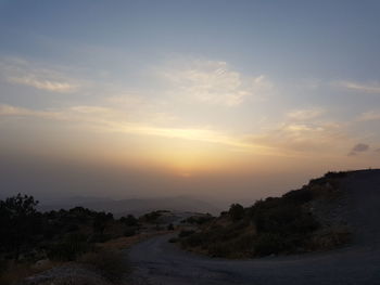 Scenic view of landscape against sky during sunset