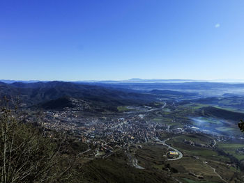 High angle view of landscape against clear blue sky