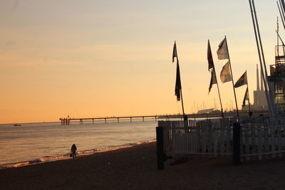 Scenic view of beach against sky during sunset