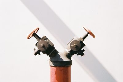 Close-up of valve against wall