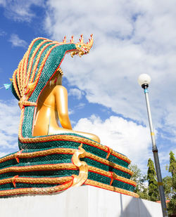 Low angle view of statue against sky