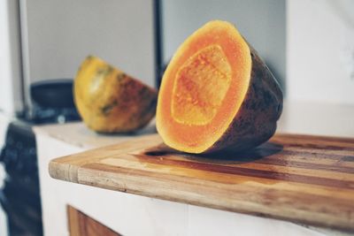 Close-up of orange slice on cutting board