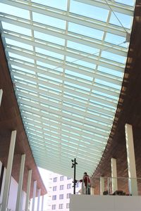 Low angle view of skylight in building against sky