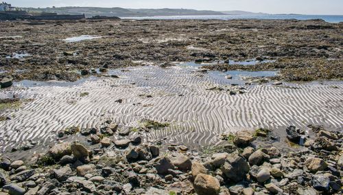 High angle view of pebbles on shore