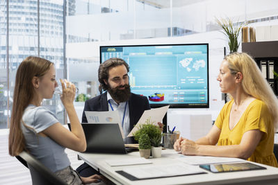 Business colleagues working in office