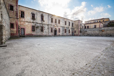 Empty alley amidst buildings in town