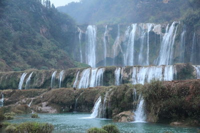 Scenic view of waterfall in forest