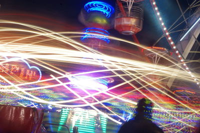 Low angle view of illuminated ferris wheel at night