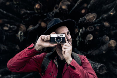 Portrait of man photographing camera