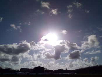 Low angle view of silhouette built structure against sky