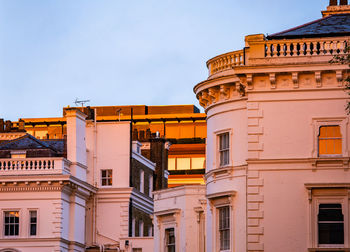 Low angle view of buildings against clear sky
